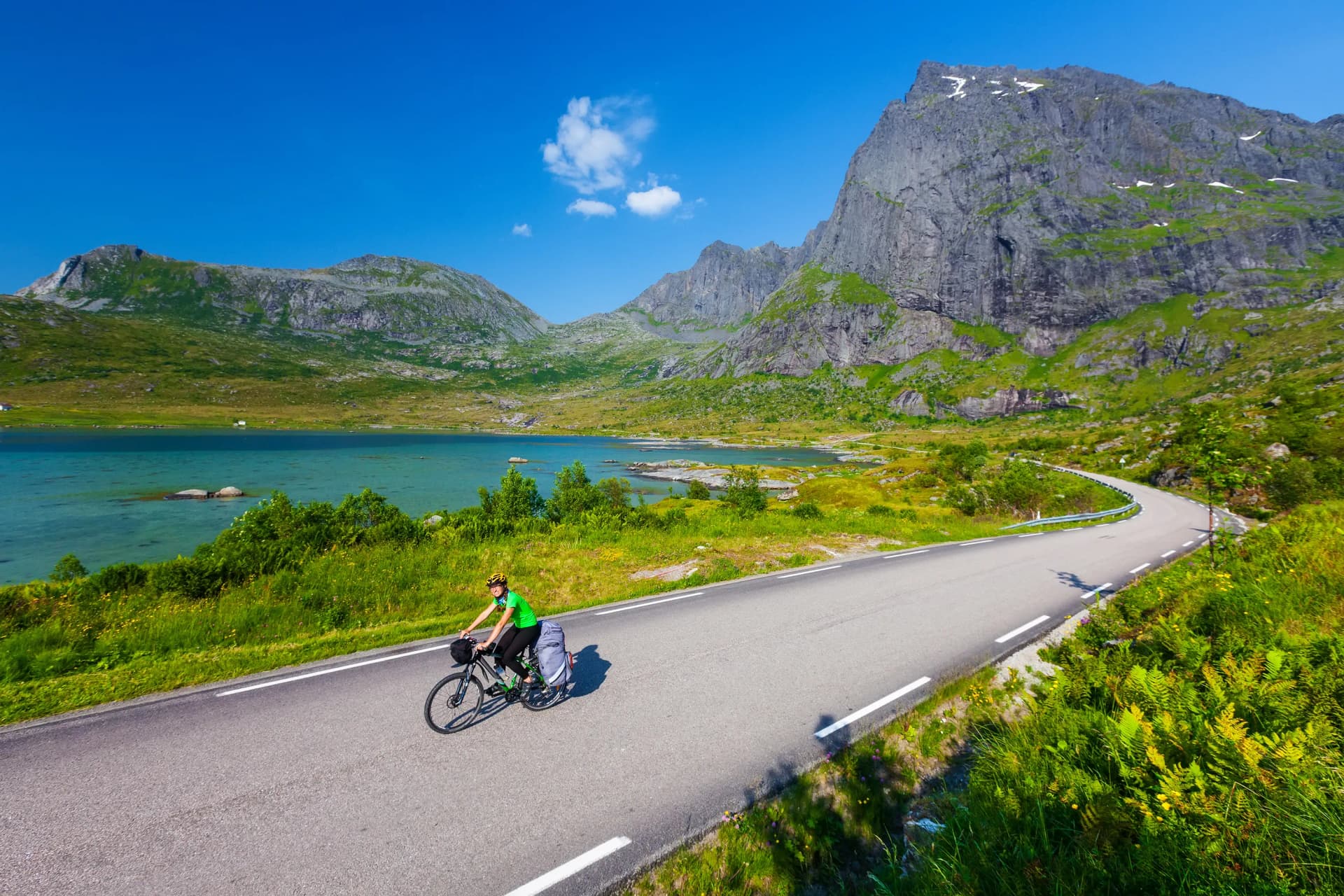 Biking in Norway against picturesque landscape. Bike, active.