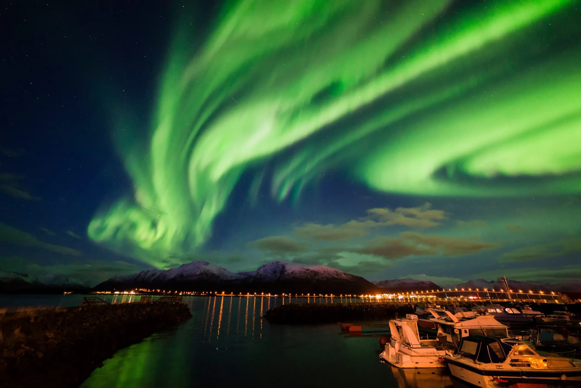 Amazing view of aurora borealis ( northern lights) over Norvegian sea .