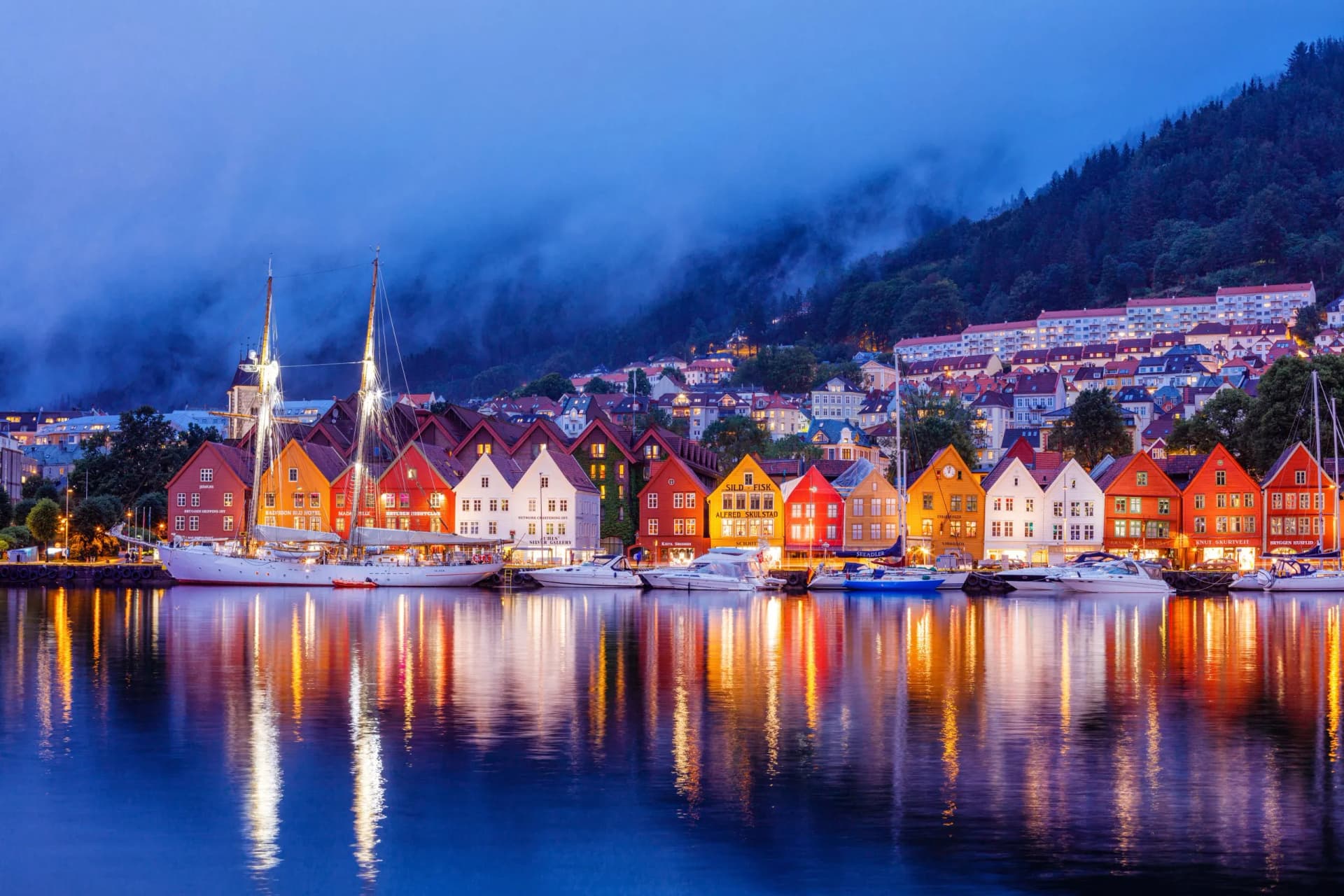 Bergen street at night with boats in Norway