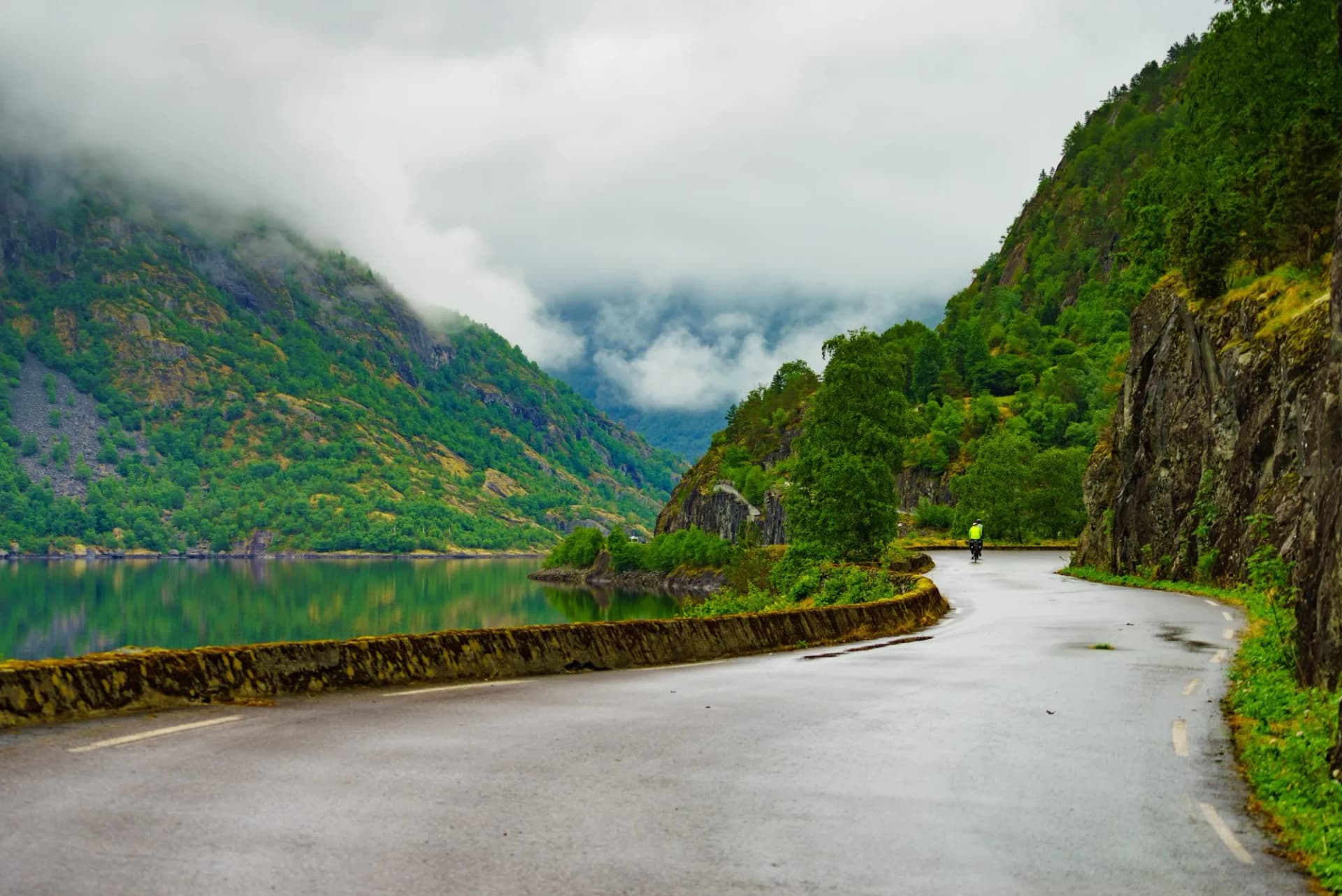 cyclist in mist norway