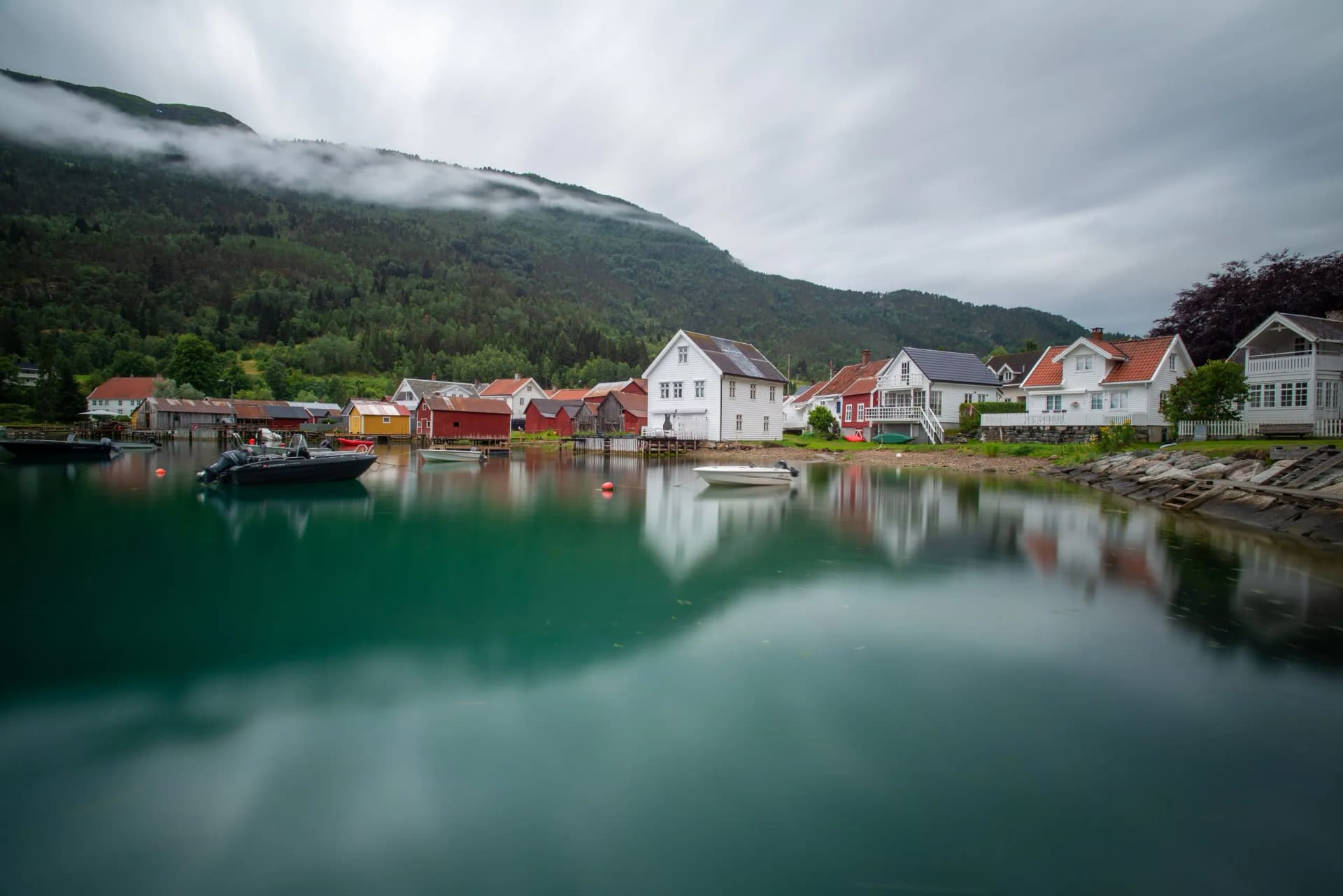 The harbor of the village of Solvorn Norway on a cloudy day